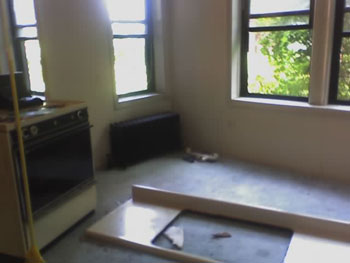 Beautiful view of stove in living room and windows.